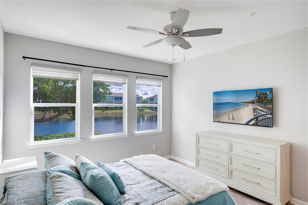 4607 Arboretum Circle, Unit 103 Naples, FL 34112 - Photo 10 of 29 a bedroom with a large bed and a window