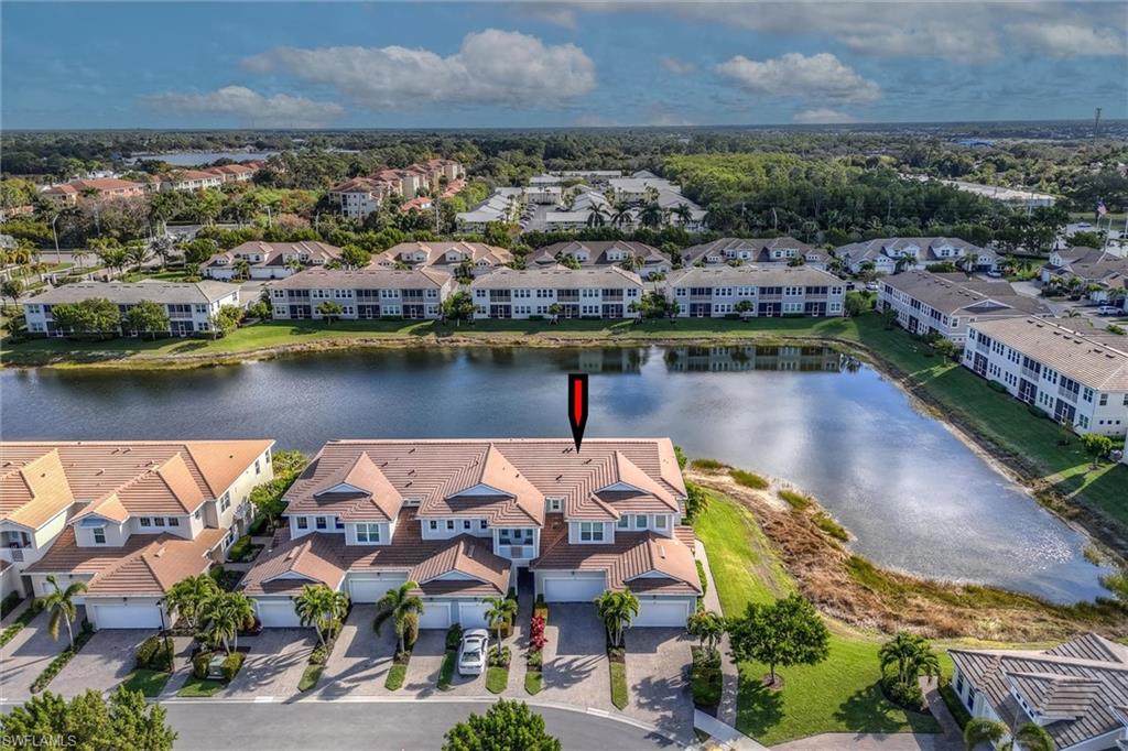 4607 Arboretum Circle, Unit 103 Naples, FL 34112 - Photo 23 of 29 an aerial view of a house with a lake view