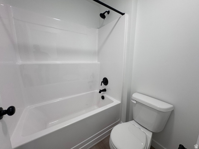 2633 Scarlet Road, Unit 259 Eagle Mountain, UT 84005 - Photo 26 of 30 Bathroom featuring a white bathtub and shower surround with matte black fixtures