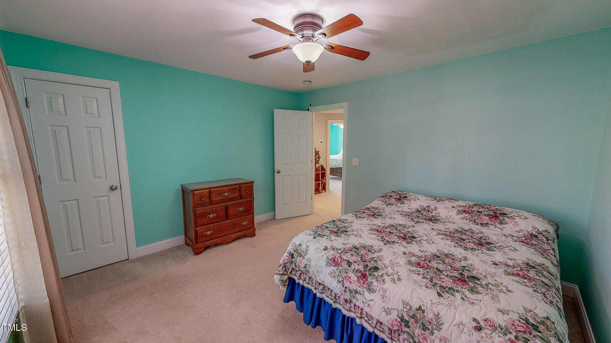 19 Rivers Edge Court Timberlake, NC 27583 - Photo 54 of 66 a bedroom with a bed and a chandelier
