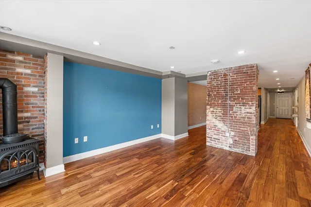 a large kitchen with stainless steel appliances granite countertop a stove and a sink