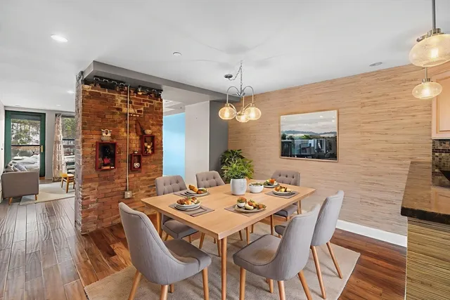 a spacious bedroom with a bed and ceiling fan