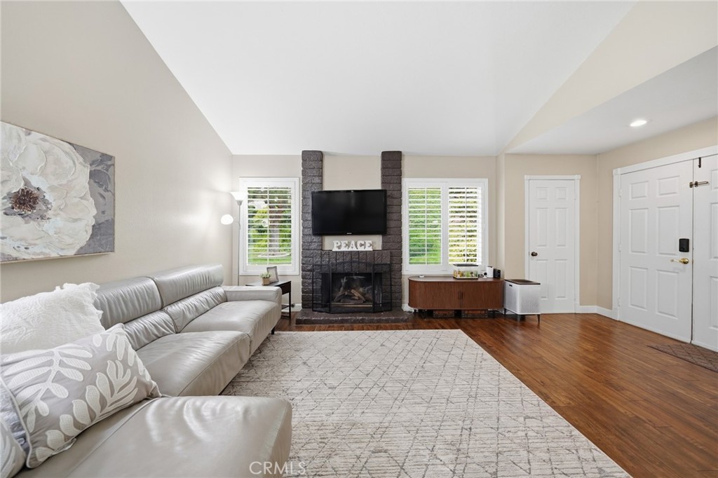 259 Scenic Way Brea, CA 92821 - Photo 4 of 62 a living room with furniture large window and fireplace
