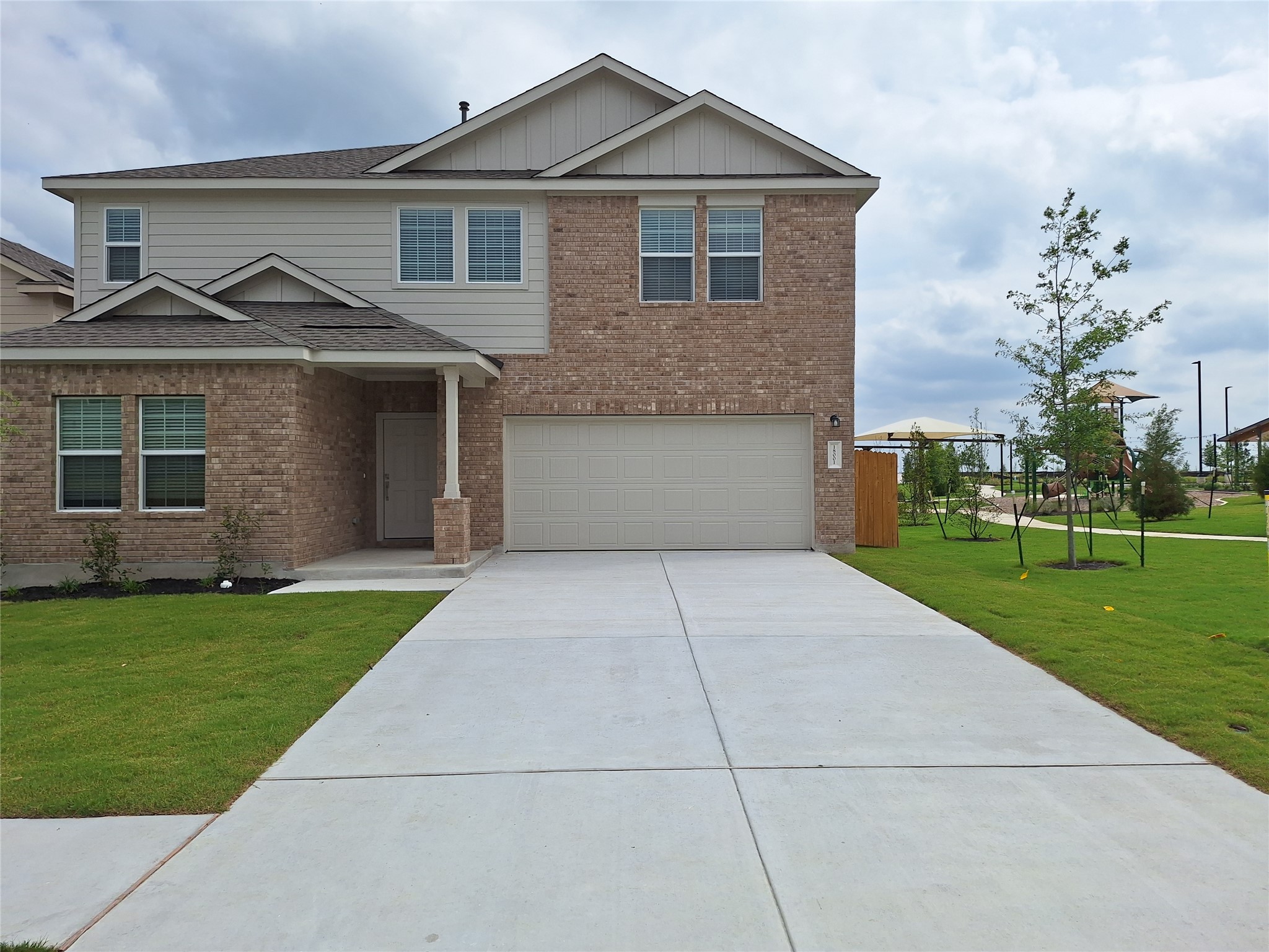 18001 Prairie Falcon Way Pflugerville, TX 78660 - Photo 13 of 38 Two-story residence featuring a brick and siding facade with an attached two-car garage