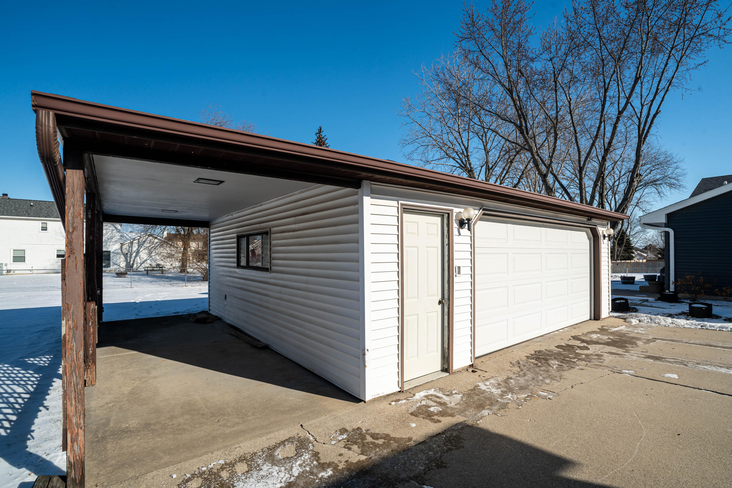 2938 Stonebridge Drive Caledonia, WI 53404 - Photo 26 of 47 Covered patio on garage/Carport