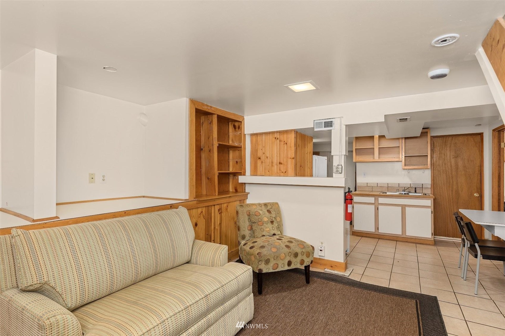 5416 20th Avenue Northeast Seattle, WA 98105 - Photo 12 of 21 a living room with furniture and kitchen view