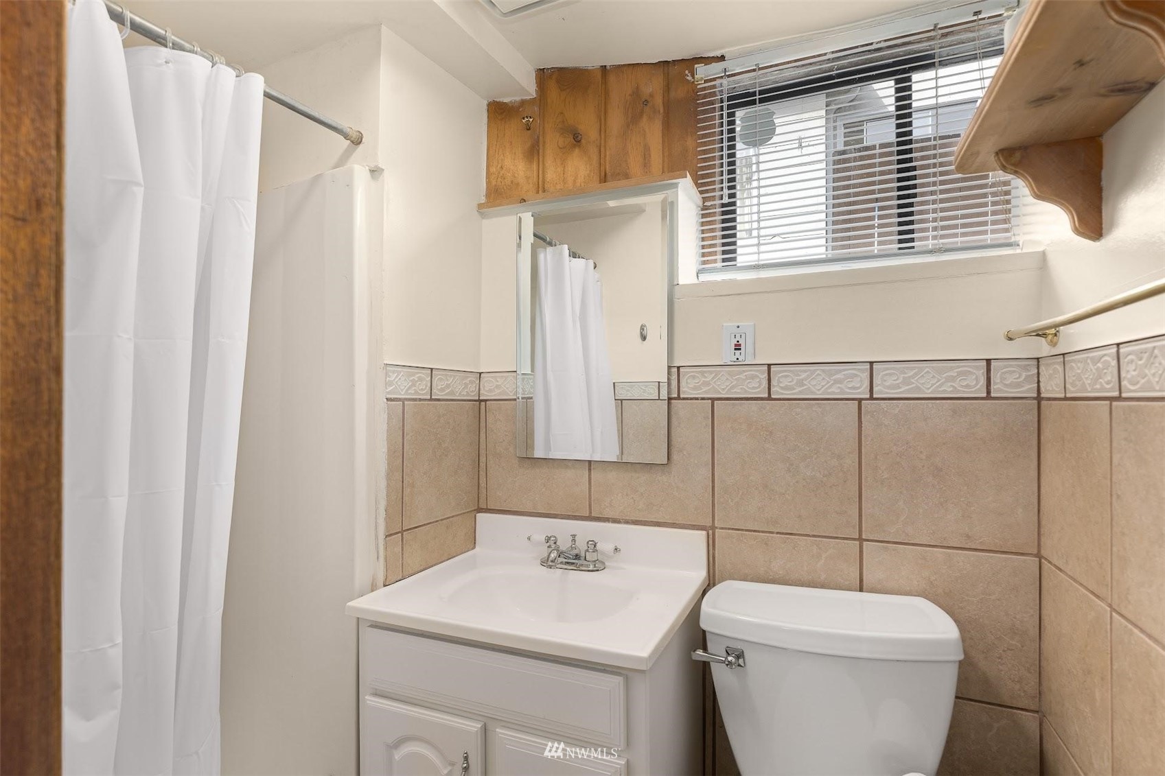 5416 20th Avenue Northeast Seattle, WA 98105 - Photo 14 of 21 a bathroom with a toilet sink and mirror