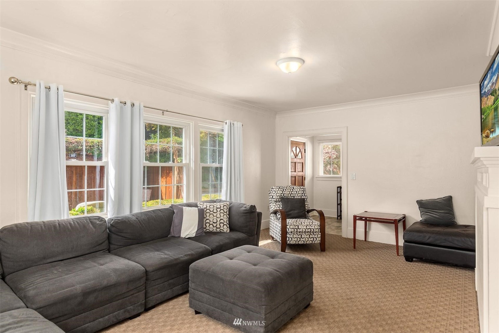 5416 20th Avenue Northeast Seattle, WA 98105 - Photo 5 of 21 a living room with furniture and a large window