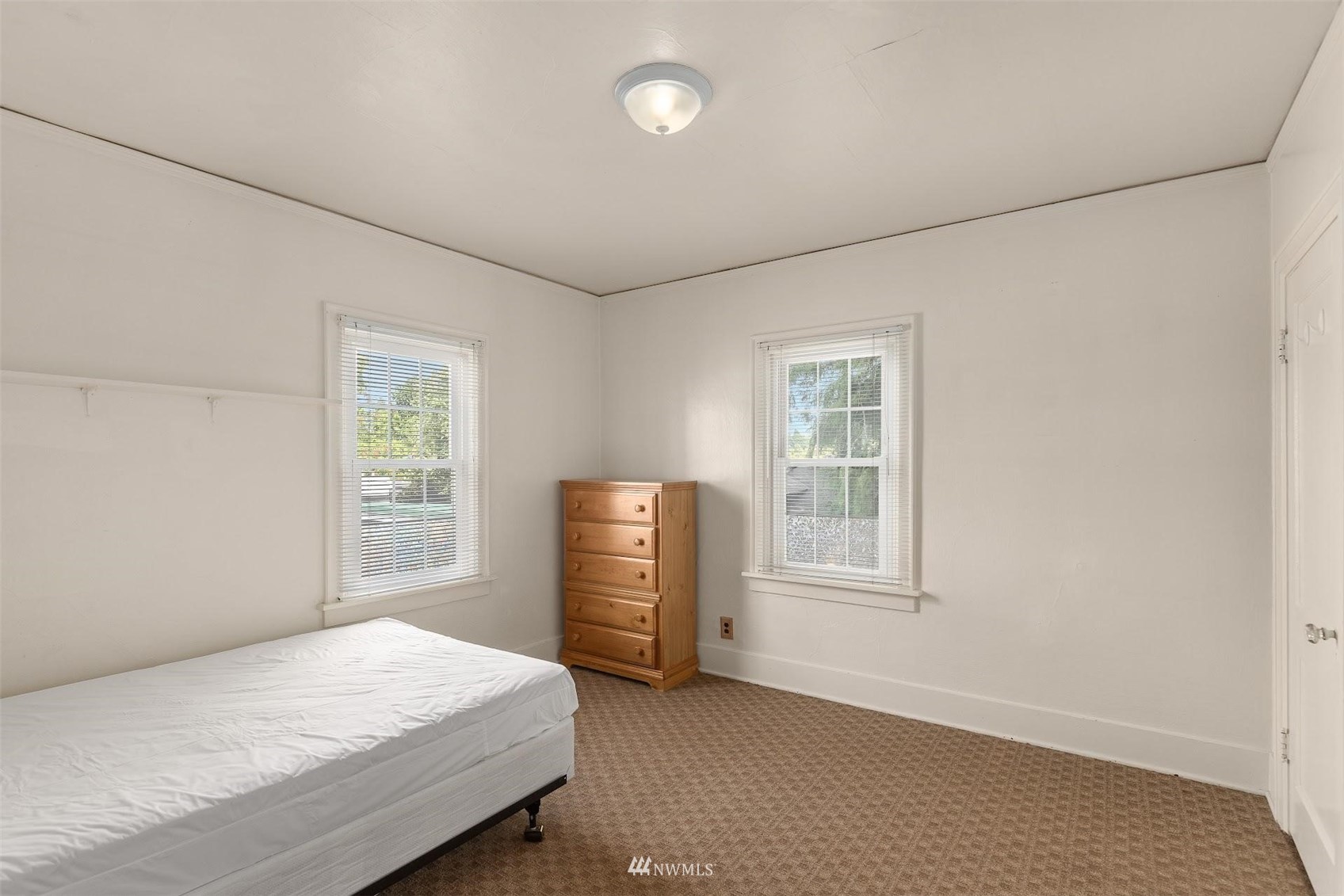 5416 20th Avenue Northeast Seattle, WA 98105 - Photo 9 of 21 a bedroom with a bed and a window