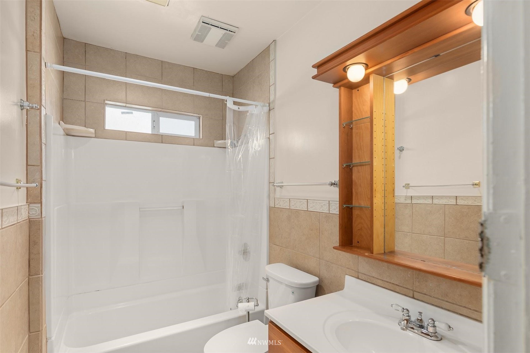 5416 20th Avenue Northeast Seattle, WA 98105 - Photo 10 of 21 a bathroom with a sink mirror toilet and bathtub