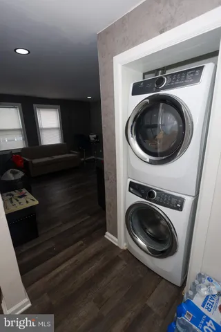 a utility room with sink dryer and washer