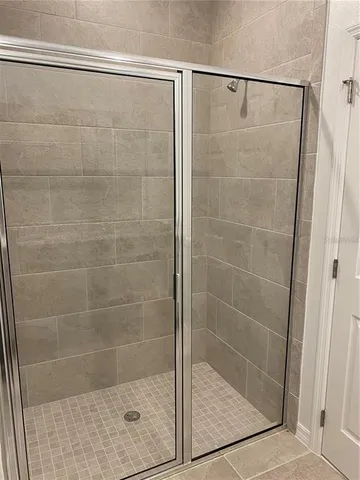 a white toilet sitting next to a white sink