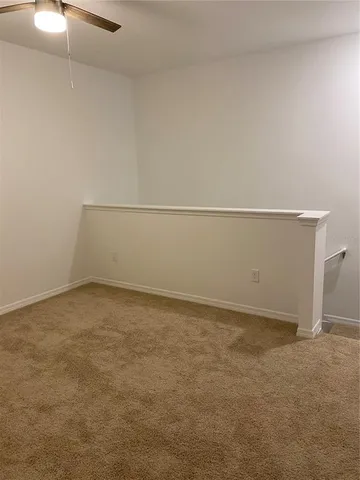 a bathroom with a granite countertop sink a toilet and bathtub