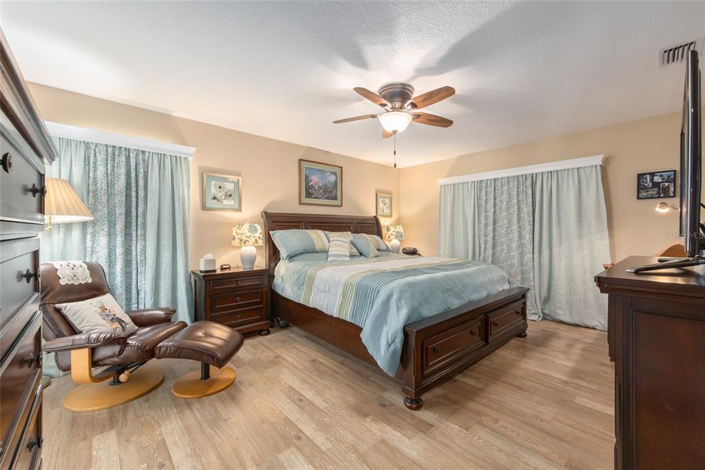 18825 Southwest 93rd Loop Dunnellon, FL 34432 - Photo 38 of 85 a bedroom with a bed and wooden floor