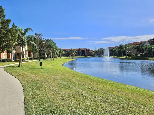 a view of a golf course with a lake view