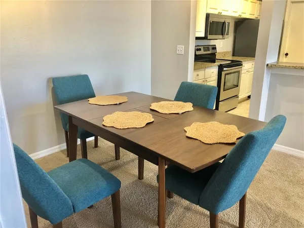a view of a dining room with furniture