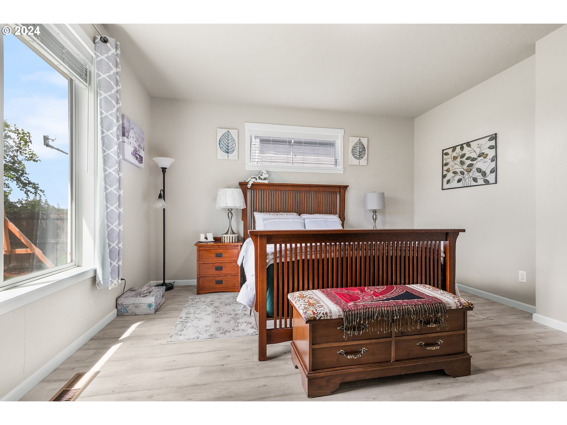 4837 North 6th Street Ridgefield, WA 98642 - Photo 17 of 43 a bedroom with a bed and wooden floor