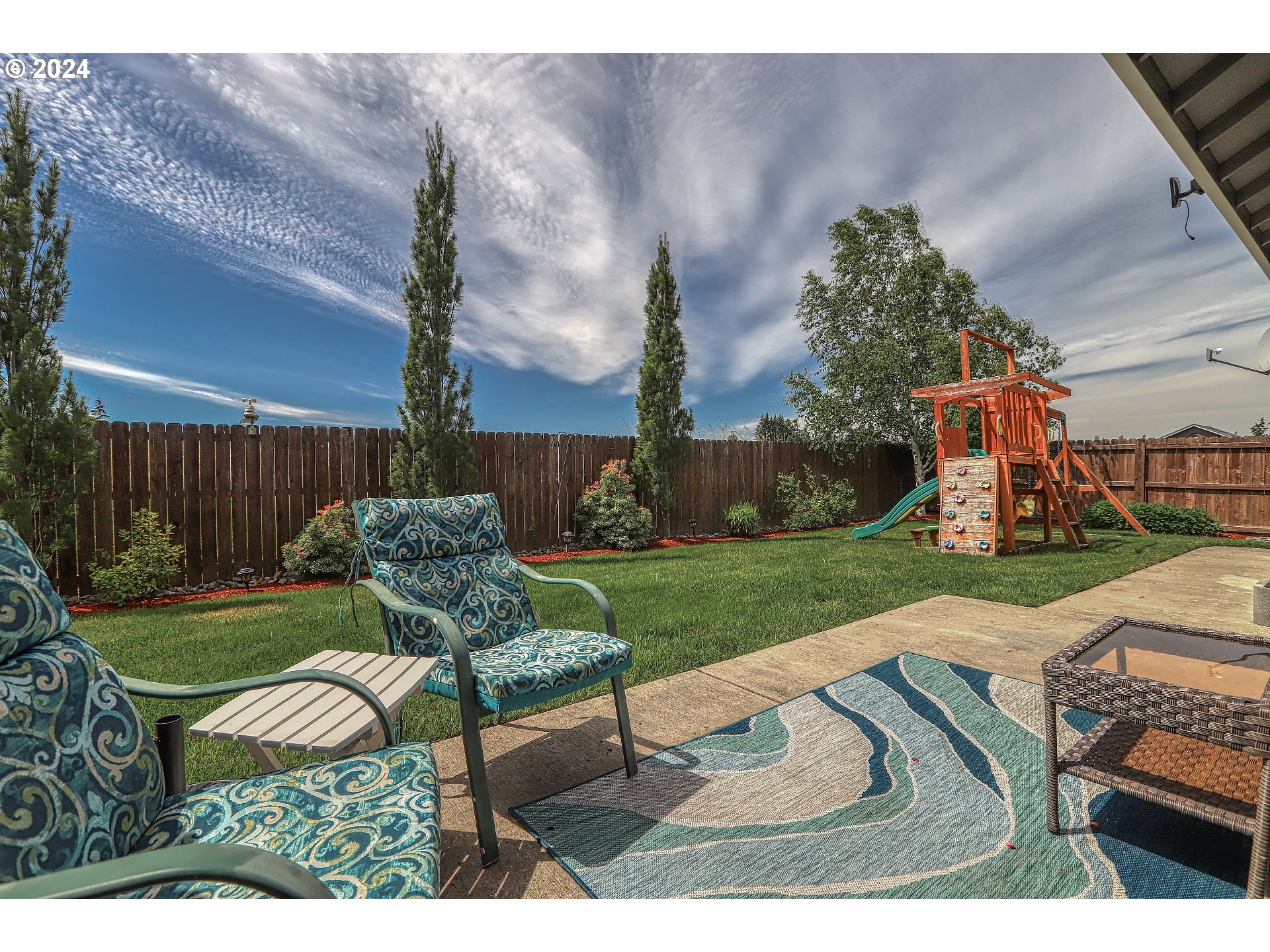 4837 North 6th Street Ridgefield, WA 98642 - Photo 39 of 43 a view of a backyard with furniture and a garden