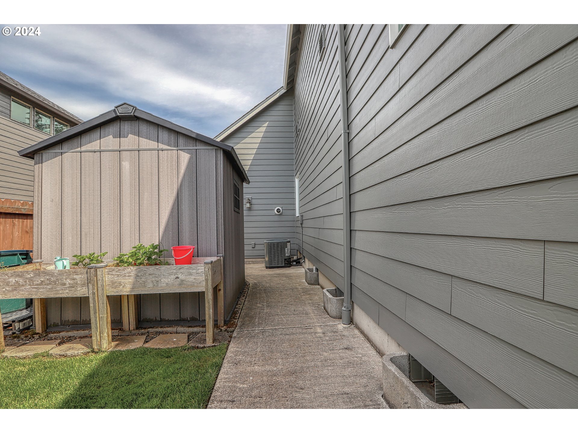 4837 North 6th Street Ridgefield, WA 98642 - Photo 41 of 43 a view of backyard with seating space and wooden fence