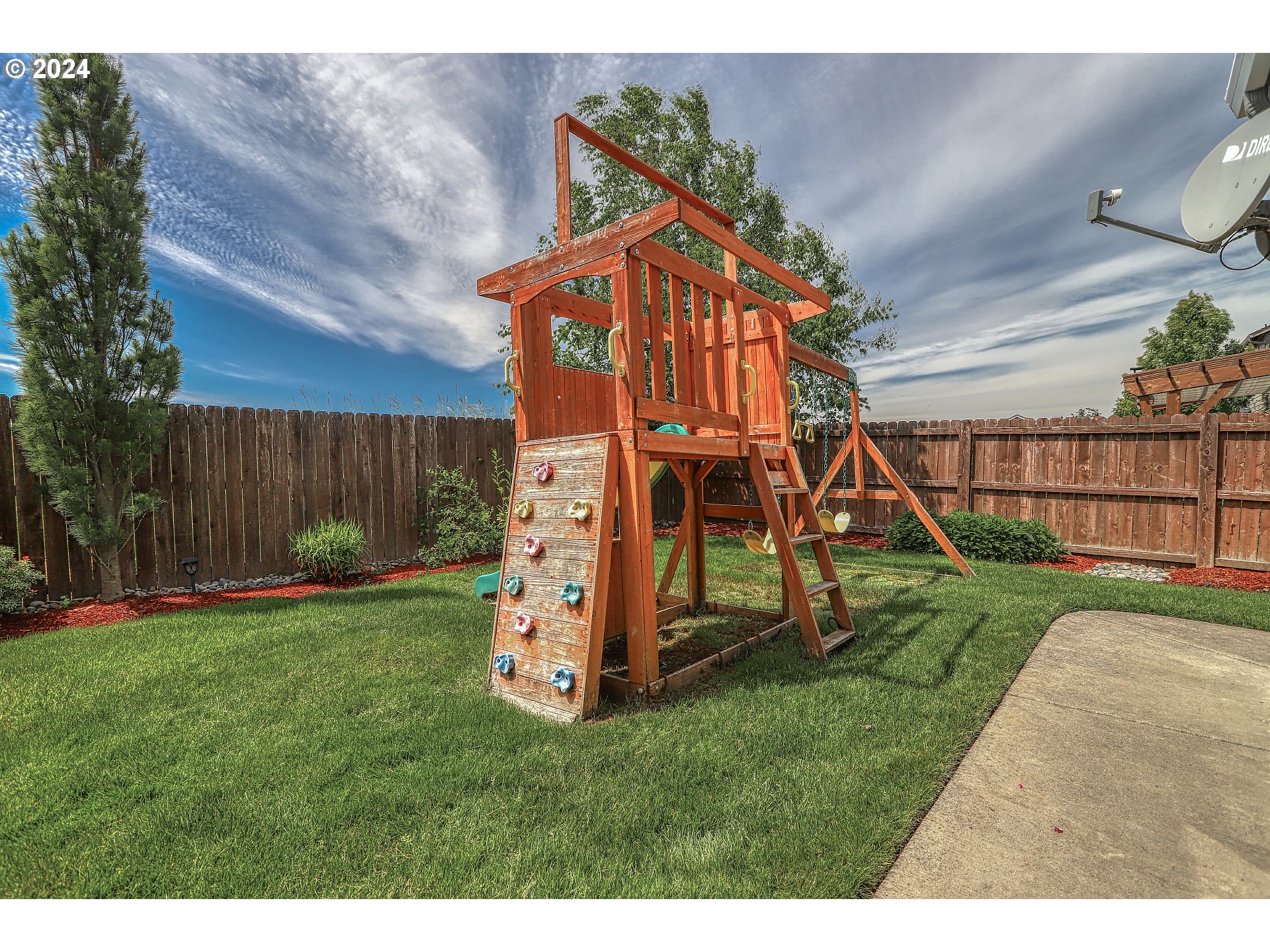 4837 North 6th Street Ridgefield, WA 98642 - Photo 43 of 43 a view of a backyard with a slide