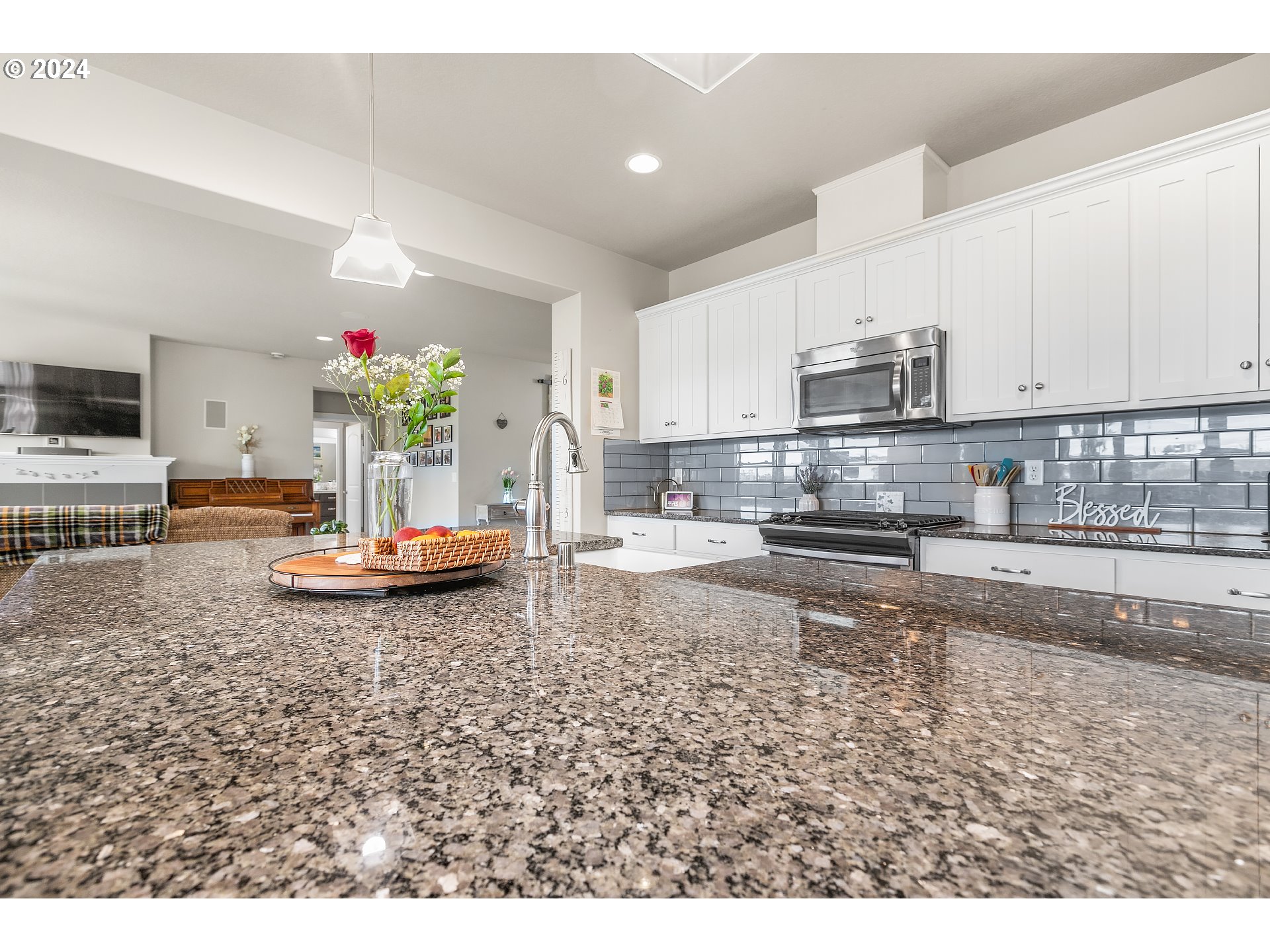 4837 North 6th Street Ridgefield, WA 98642 - Photo 8 of 43 a kitchen with sink refrigerator and microwave