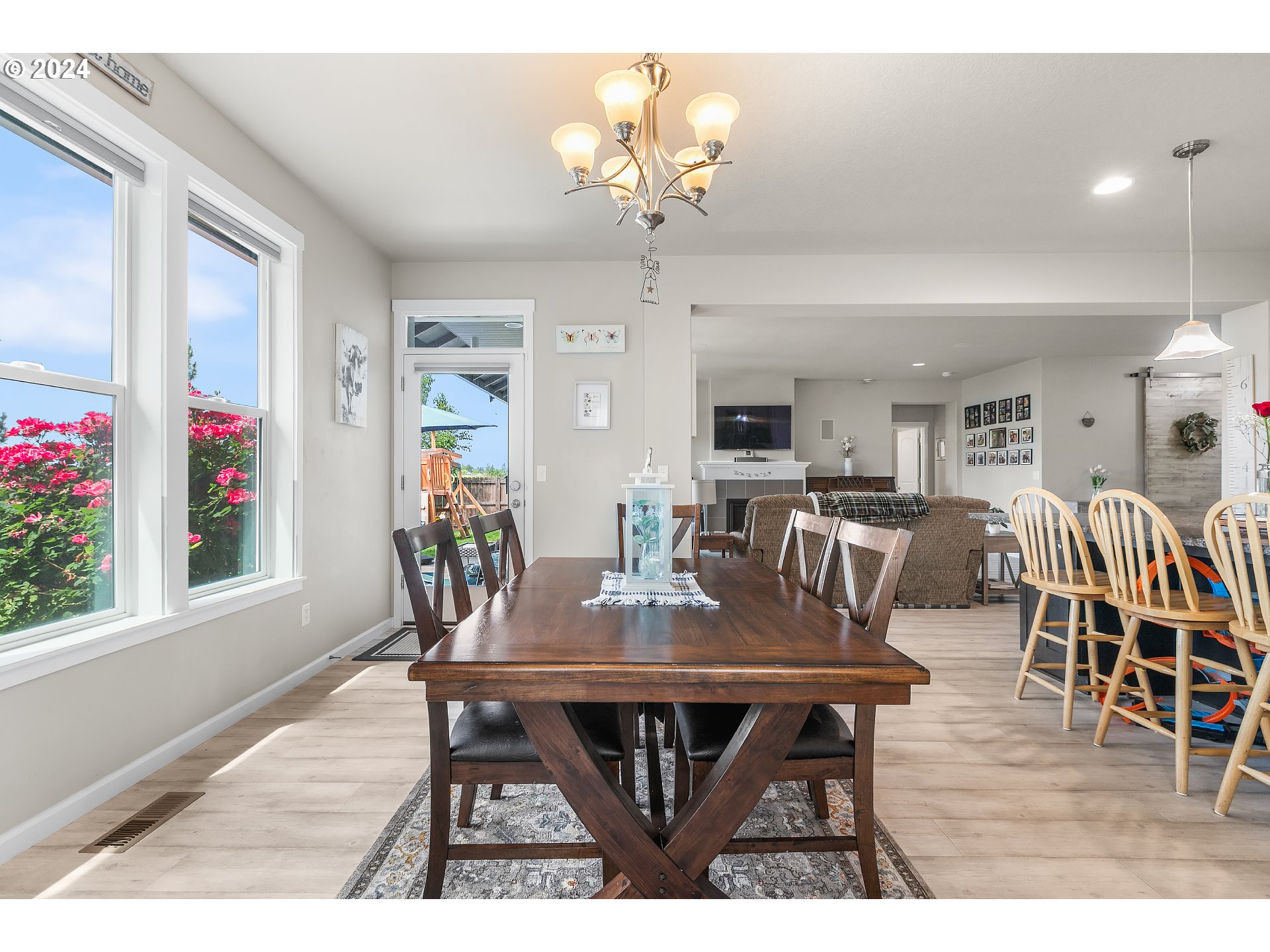 4837 North 6th Street Ridgefield, WA 98642 - Photo 9 of 43 a view of a dining room with furniture and wooden floor