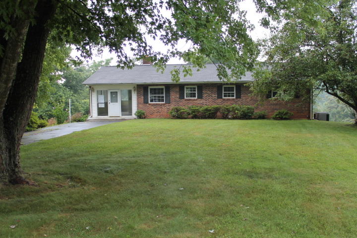 1798 Algoma Road Callaway, VA 24067 - Photo 1 of 23 a front view of a house with a garden