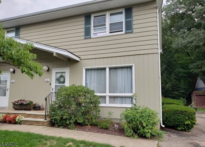 19 Grove Street, Unit B Wanaque, NJ 07465 - Photo 2 of 24 front view of a house with a yard