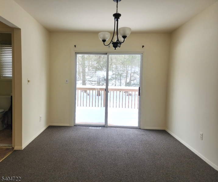 19 Grove Street, Unit B Wanaque, NJ 07465 - Photo 6 of 24 a view of an empty room with a window
