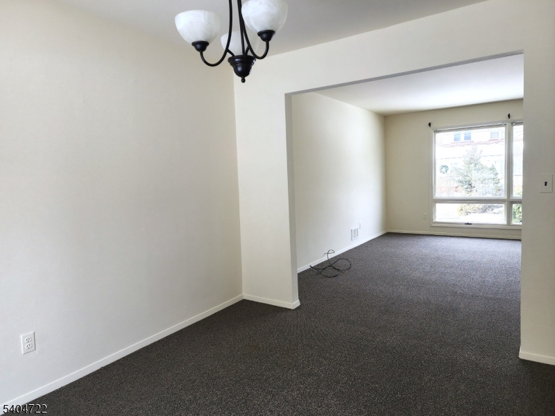 19 Grove Street, Unit B Wanaque, NJ 07465 - Photo 8 of 24 a view of empty room with windows