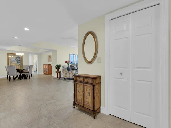 a living room with furniture a dining table a table and chairs