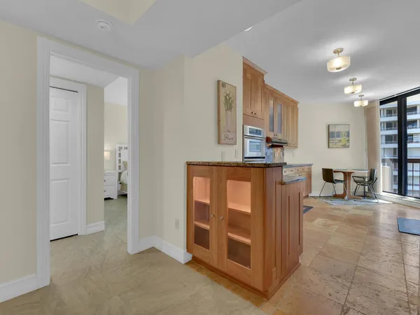 a kitchen with stainless steel appliances granite countertop a stove and a refrigerator