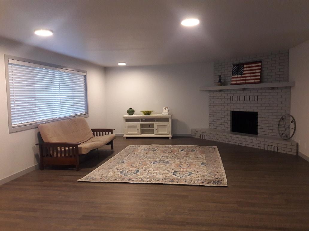 1610 Canyon Road Redding, CA 96001 - Photo 12 of 41 a living room with furniture and a fireplace