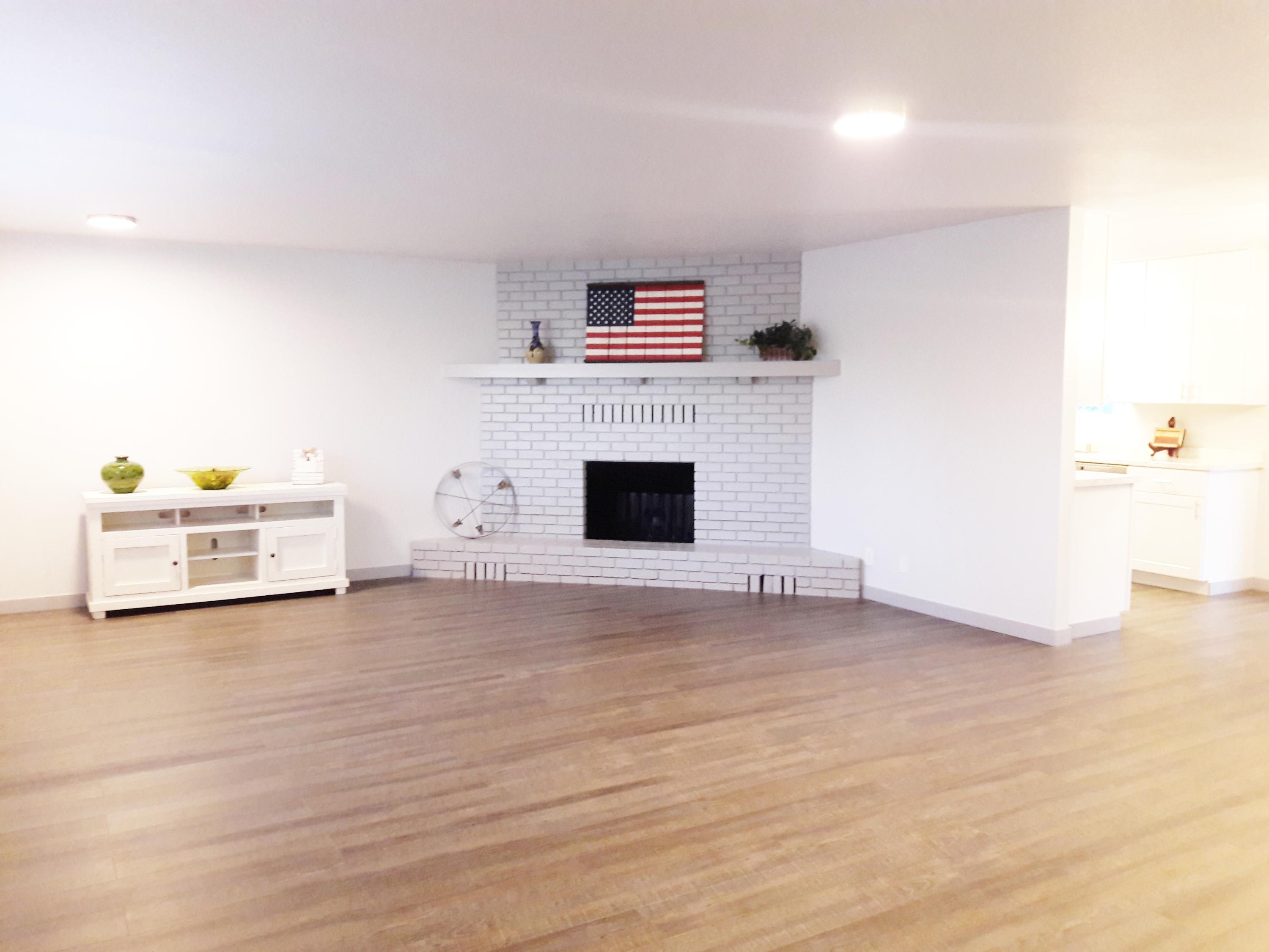 1610 Canyon Road Redding, CA 96001 - Photo 13 of 41 a view of a livingroom with an empty space and a fireplace