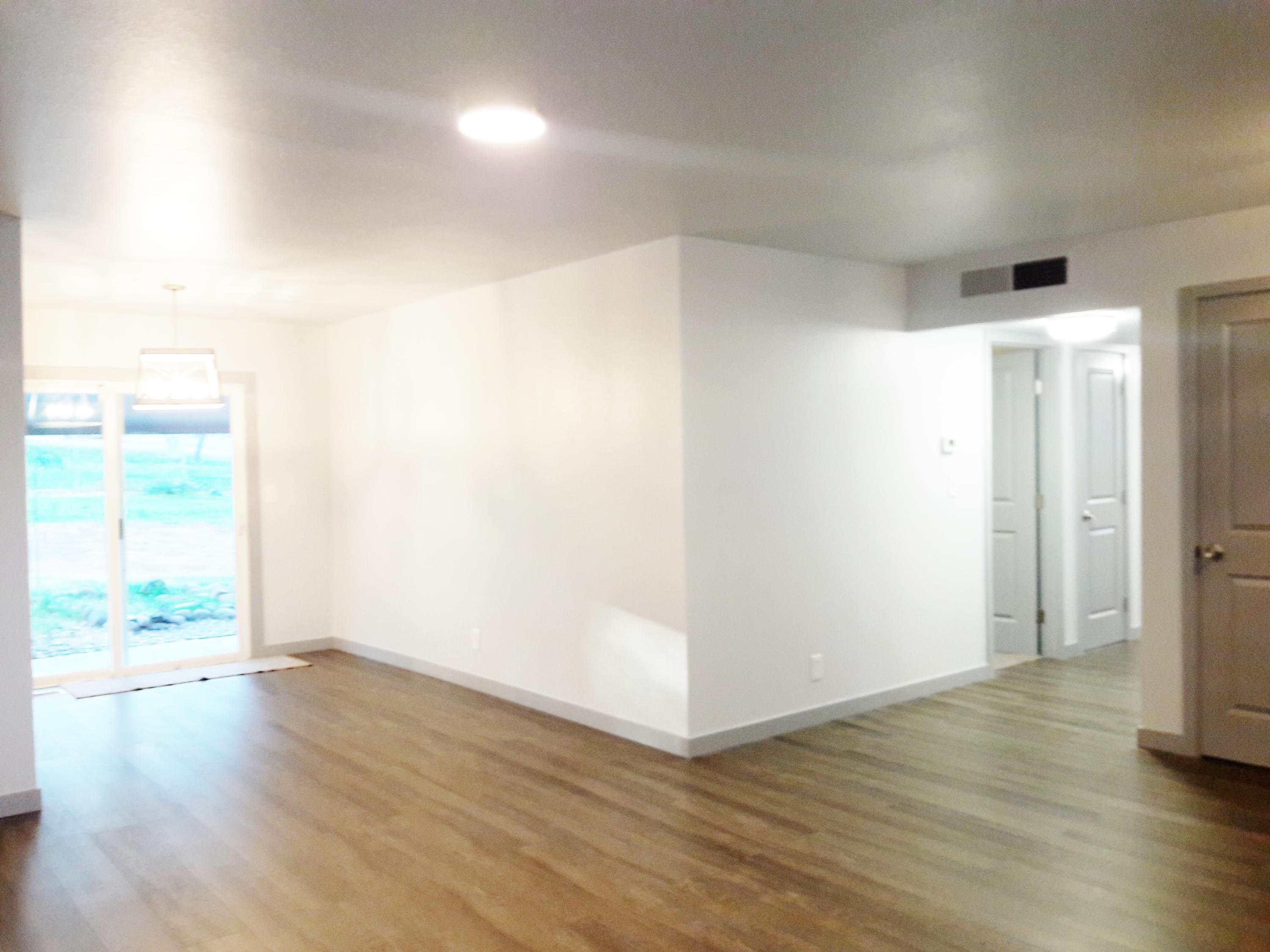 1610 Canyon Road Redding, CA 96001 - Photo 14 of 41 a view of an empty room with wooden floor and a window