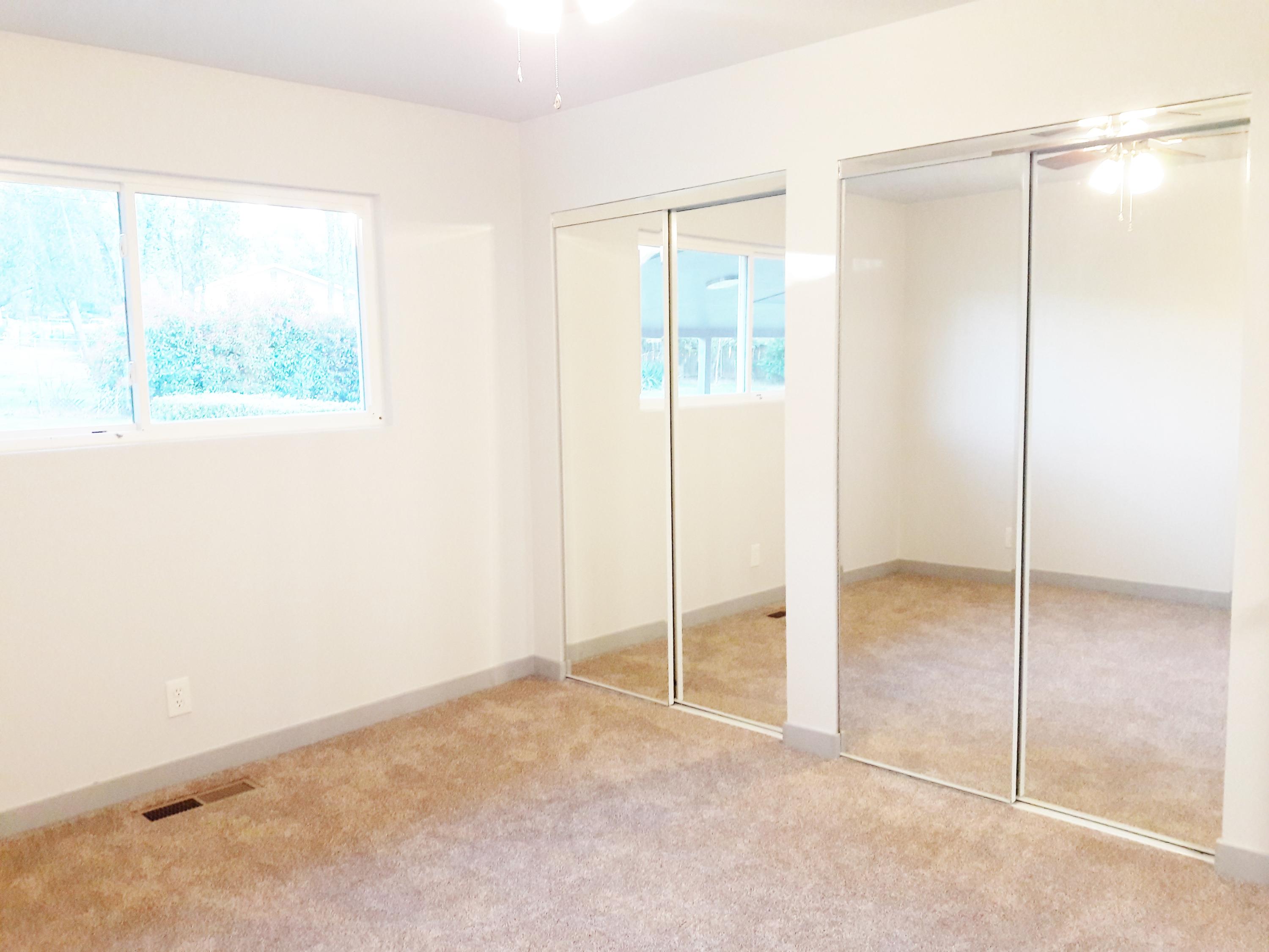 1610 Canyon Road Redding, CA 96001 - Photo 19 of 41 an empty room with sliding glass door