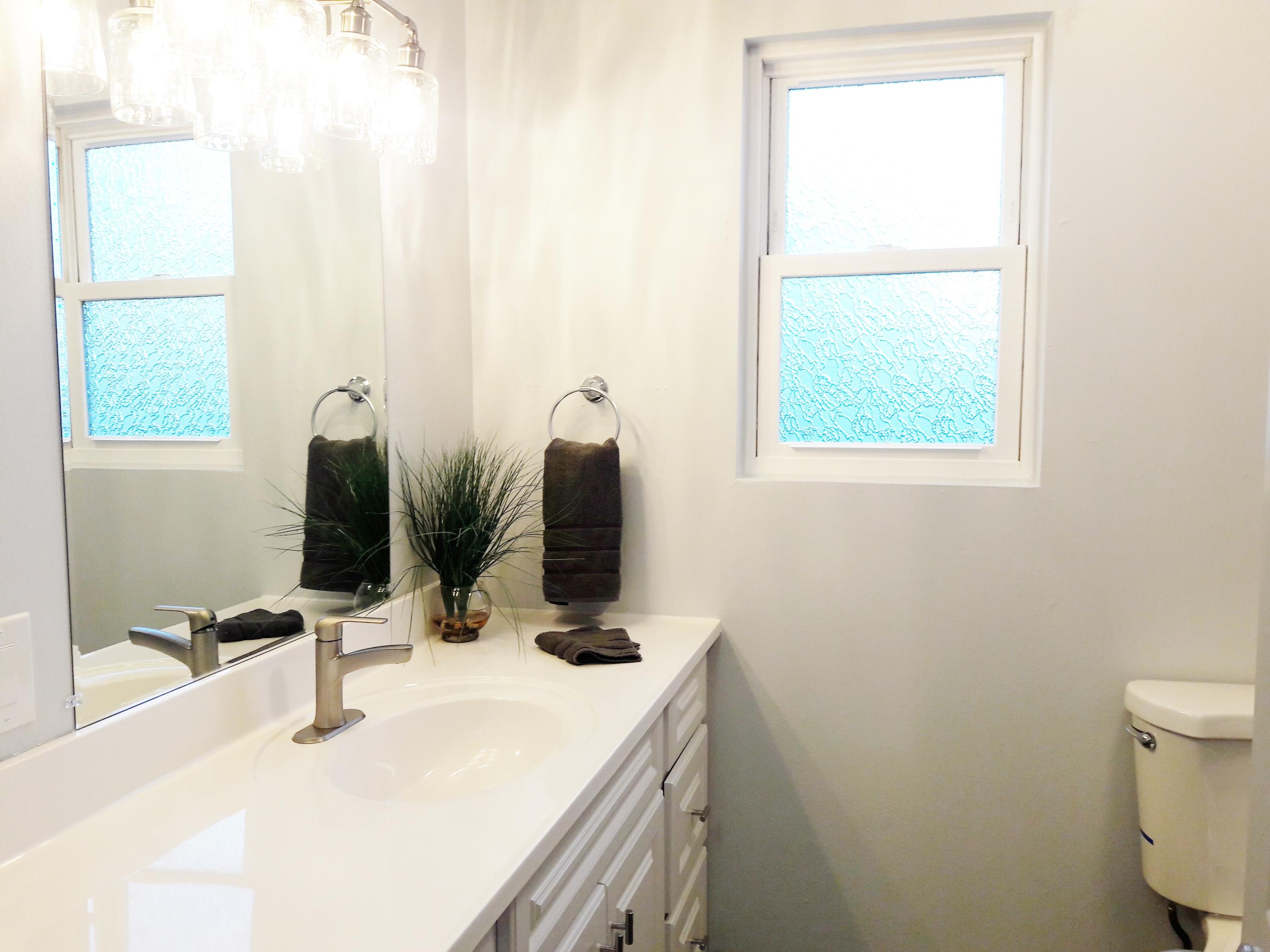 1610 Canyon Road Redding, CA 96001 - Photo 24 of 41 a bathroom with a sink and a mirror