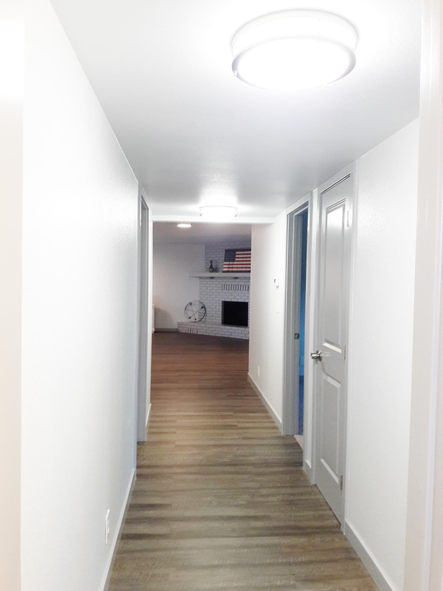 1610 Canyon Road Redding, CA 96001 - Photo 26 of 41 a view of a hallway with wooden floor
