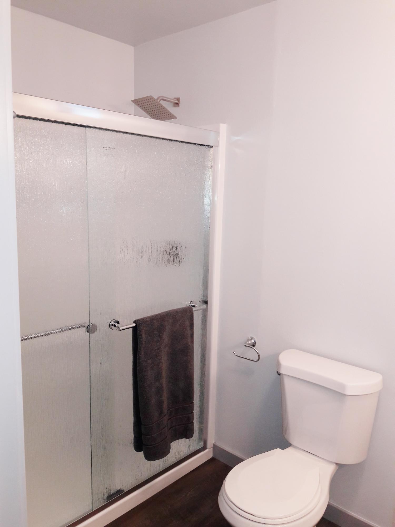 1610 Canyon Road Redding, CA 96001 - Photo 29 of 41 a white toilet sitting next to a shower