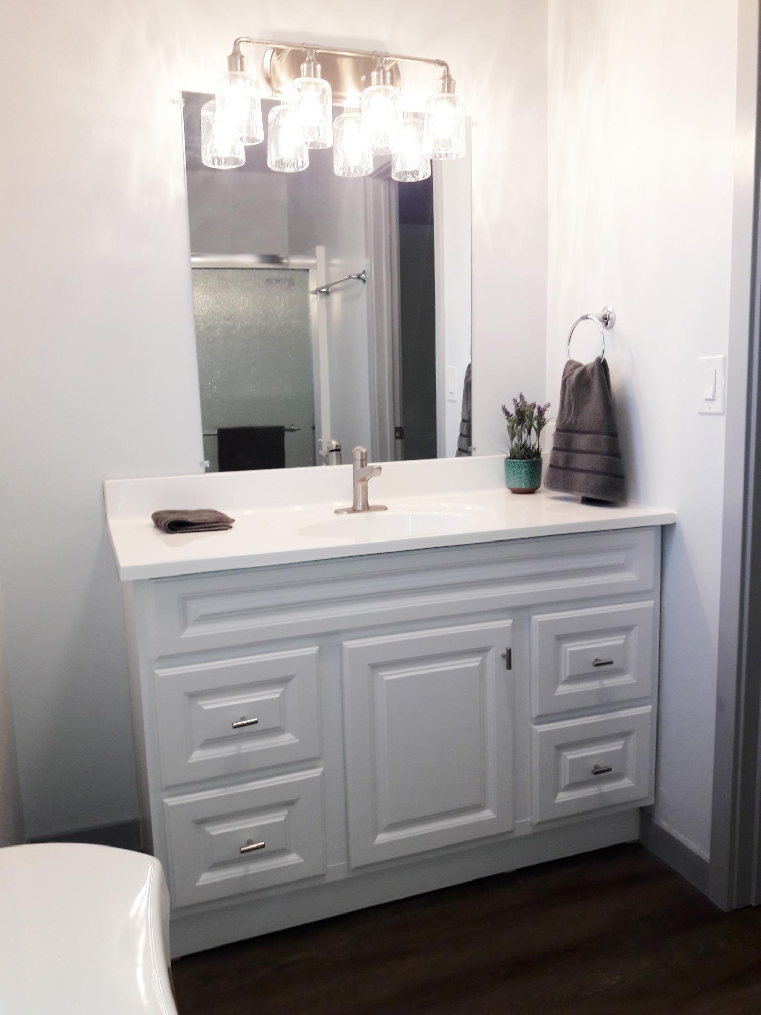 1610 Canyon Road Redding, CA 96001 - Photo 30 of 41 a bathroom with a sink vanity and a mirror