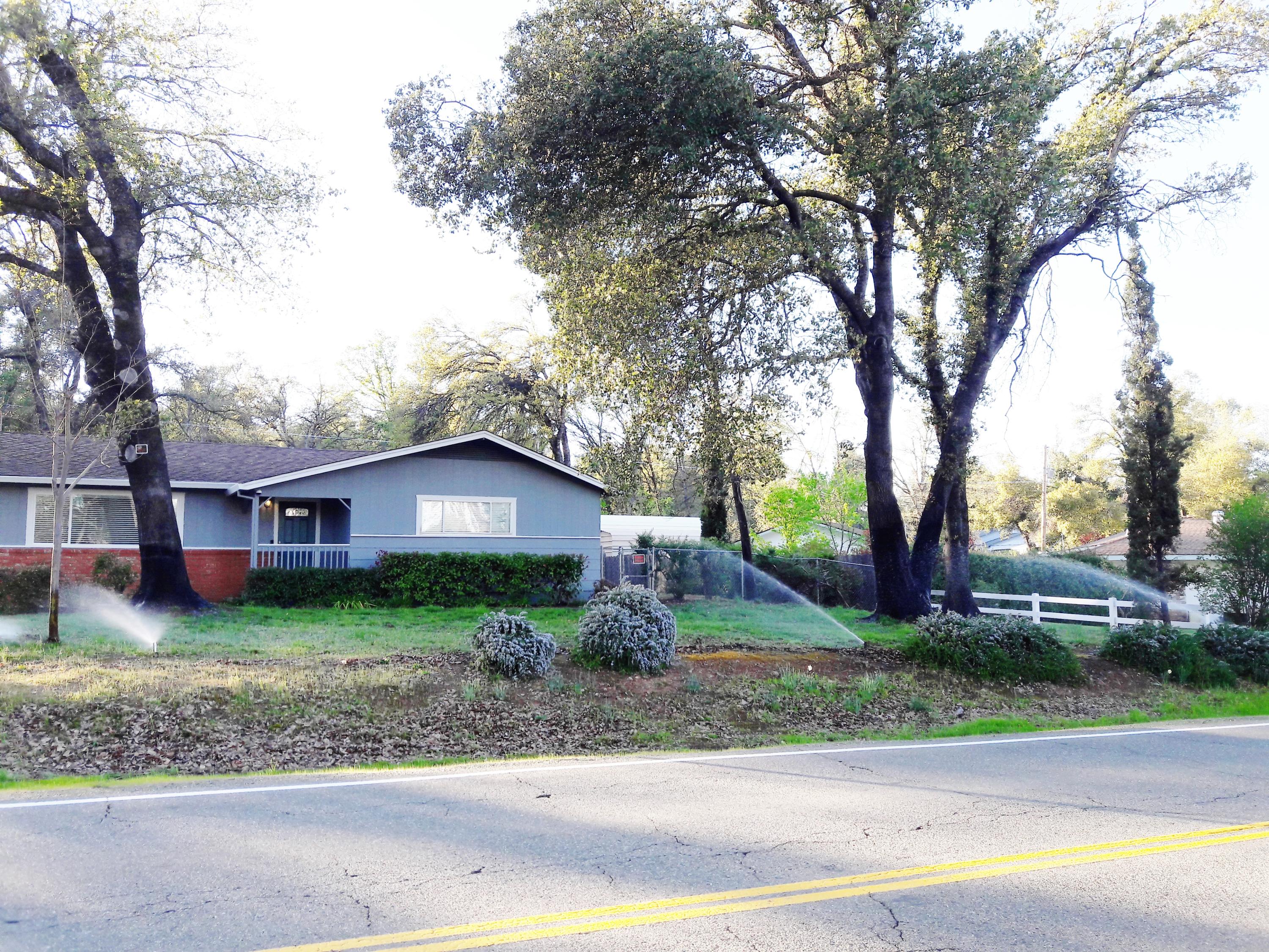 1610 Canyon Road Redding, CA 96001 - Photo 3 of 41 front view of a house with a yard