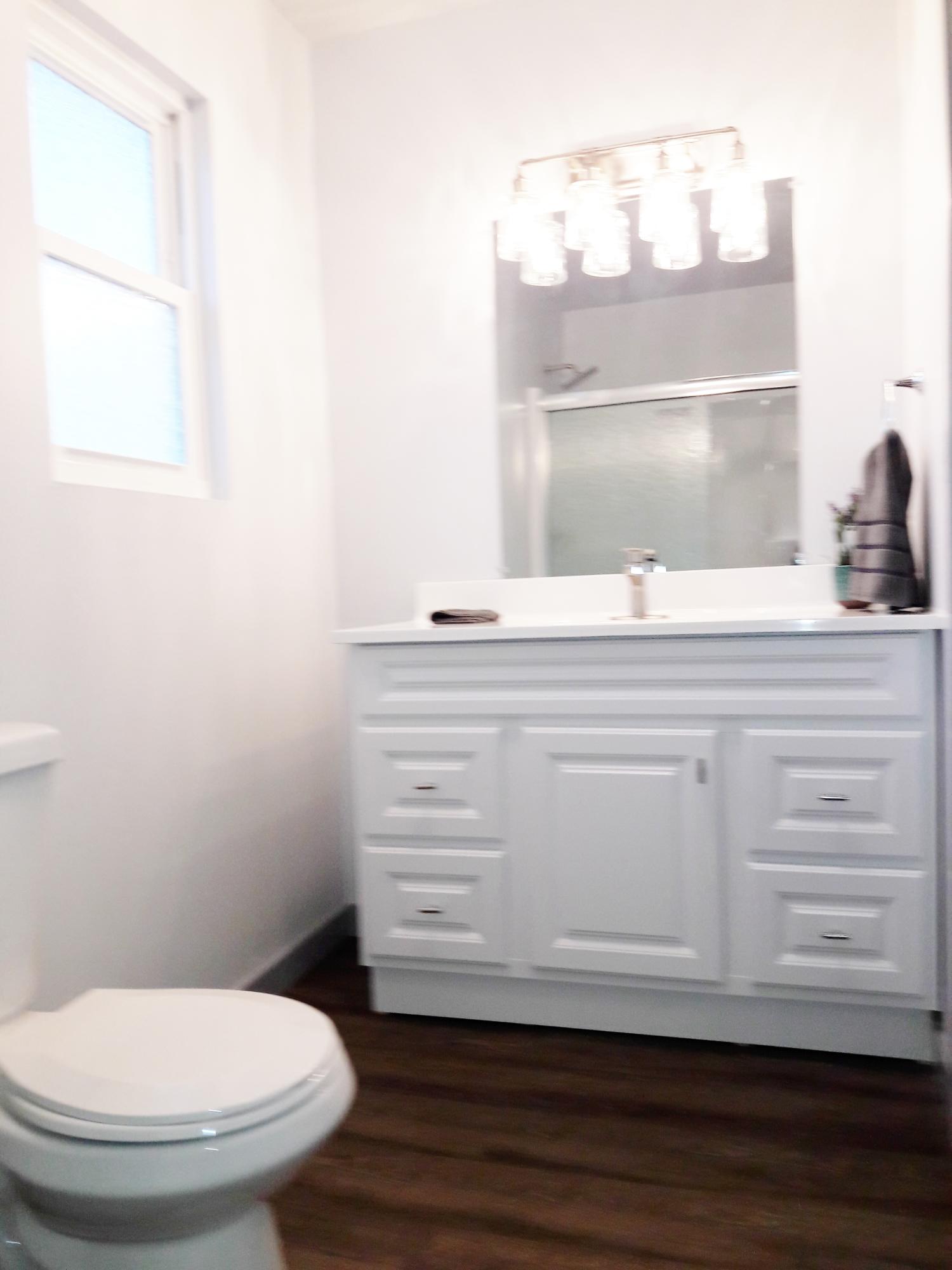 1610 Canyon Road Redding, CA 96001 - Photo 31 of 41 a bathroom with a toilet and a sink