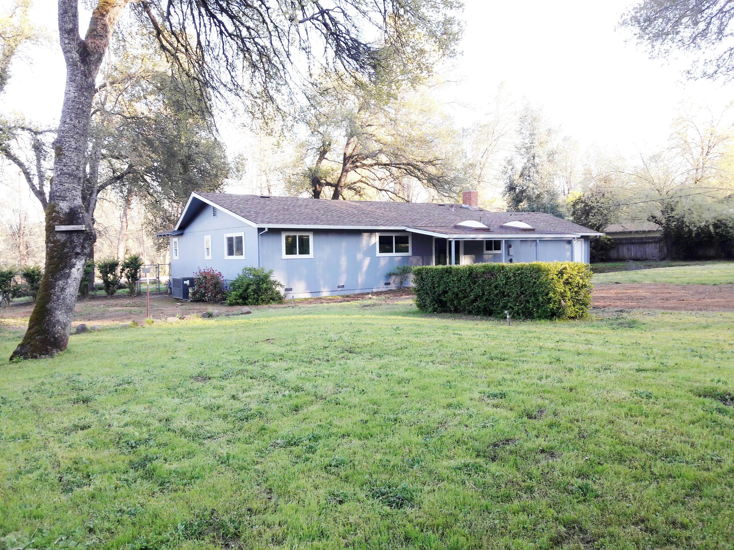 1610 Canyon Road Redding, CA 96001 - Photo 33 of 41 a front view of house with yard and green space
