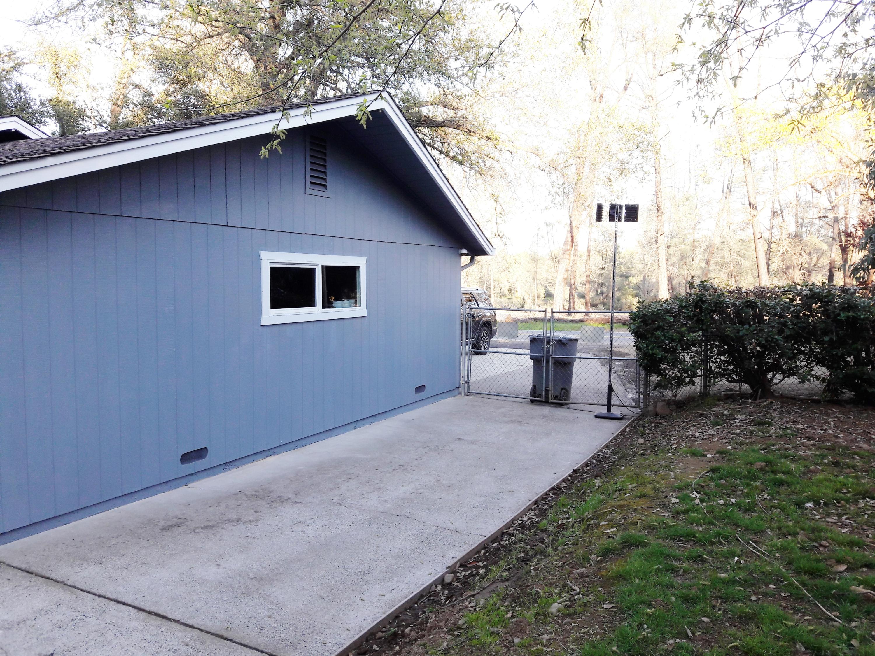 1610 Canyon Road Redding, CA 96001 - Photo 37 of 41 a view of backyard of house with outdoor seating and green space