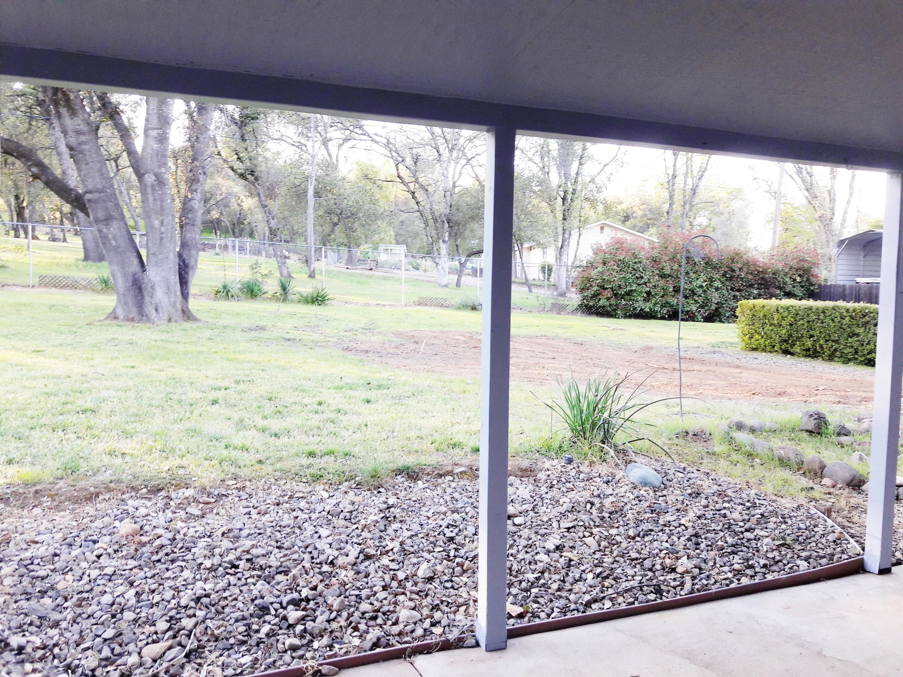 1610 Canyon Road Redding, CA 96001 - Photo 39 of 41 a view of a porch with a yard