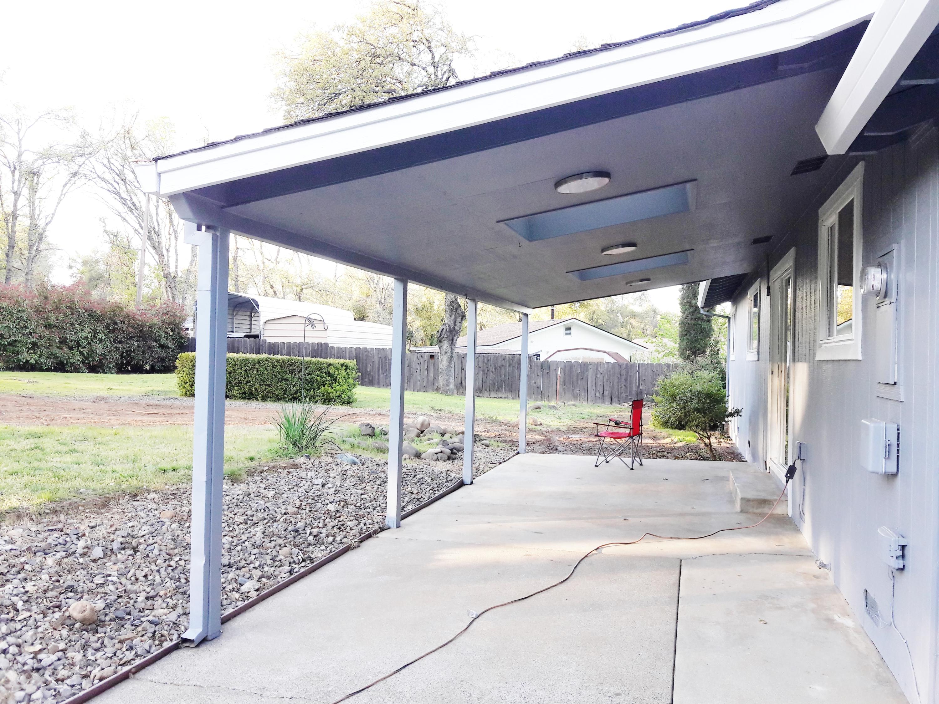 1610 Canyon Road Redding, CA 96001 - Photo 40 of 41 a view of a backyard with porch and sitting area