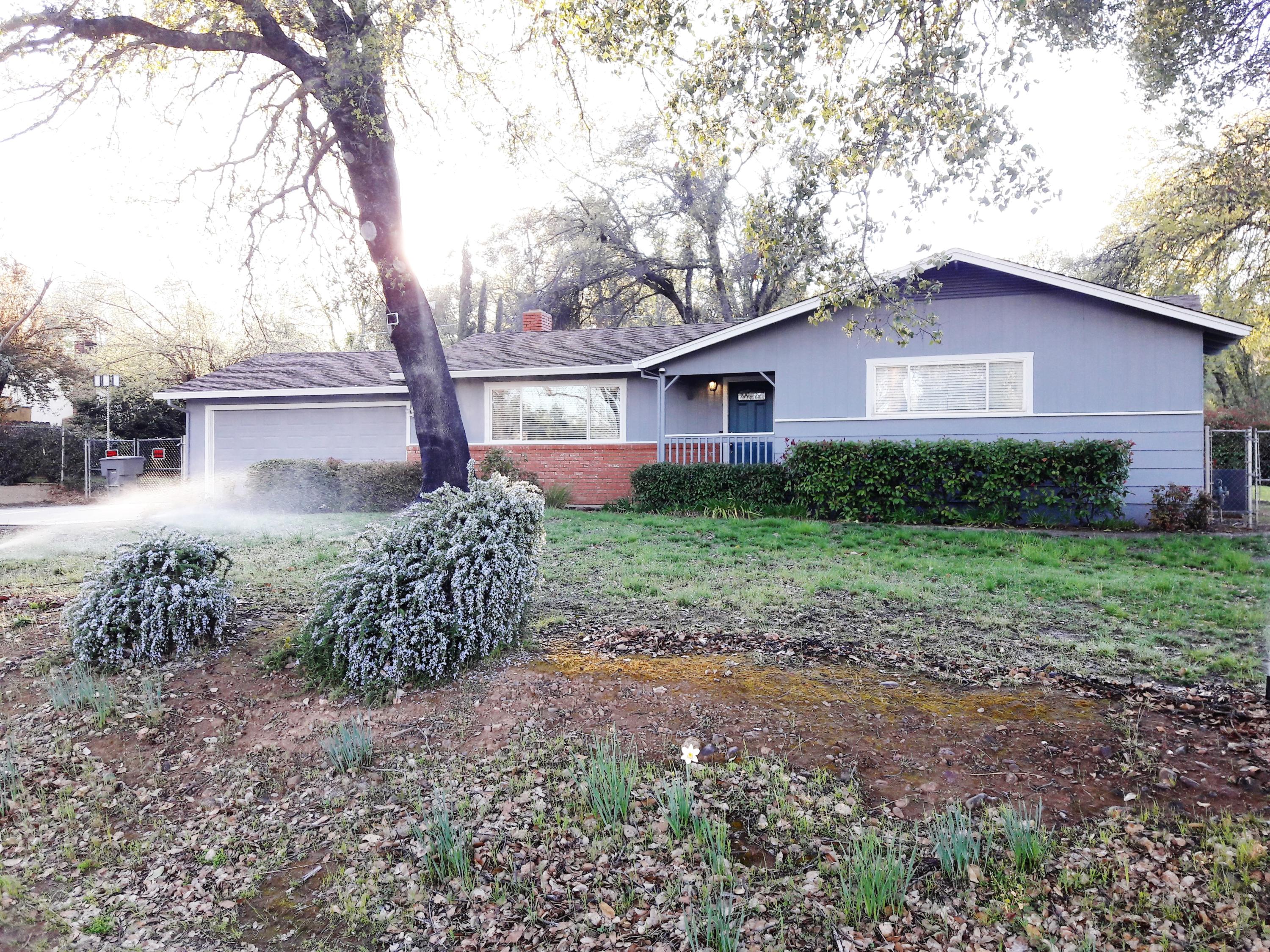 1610 Canyon Road Redding, CA 96001 - Photo 4 of 41 a front view of a house with garden