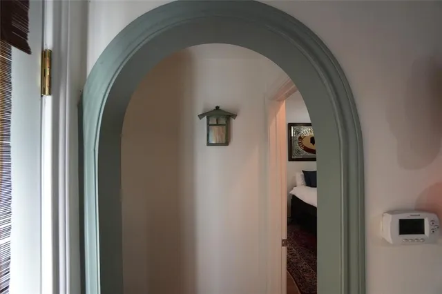 a close view of a wooden door and a shower curtain