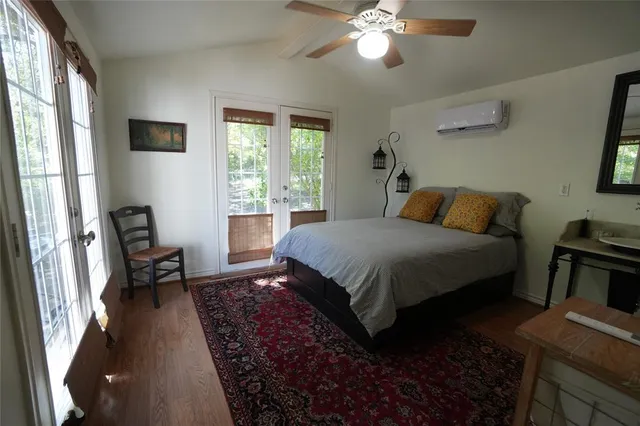 a bedroom with a bed furniture and a window