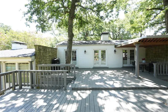 a view of a house with a tree in the patio